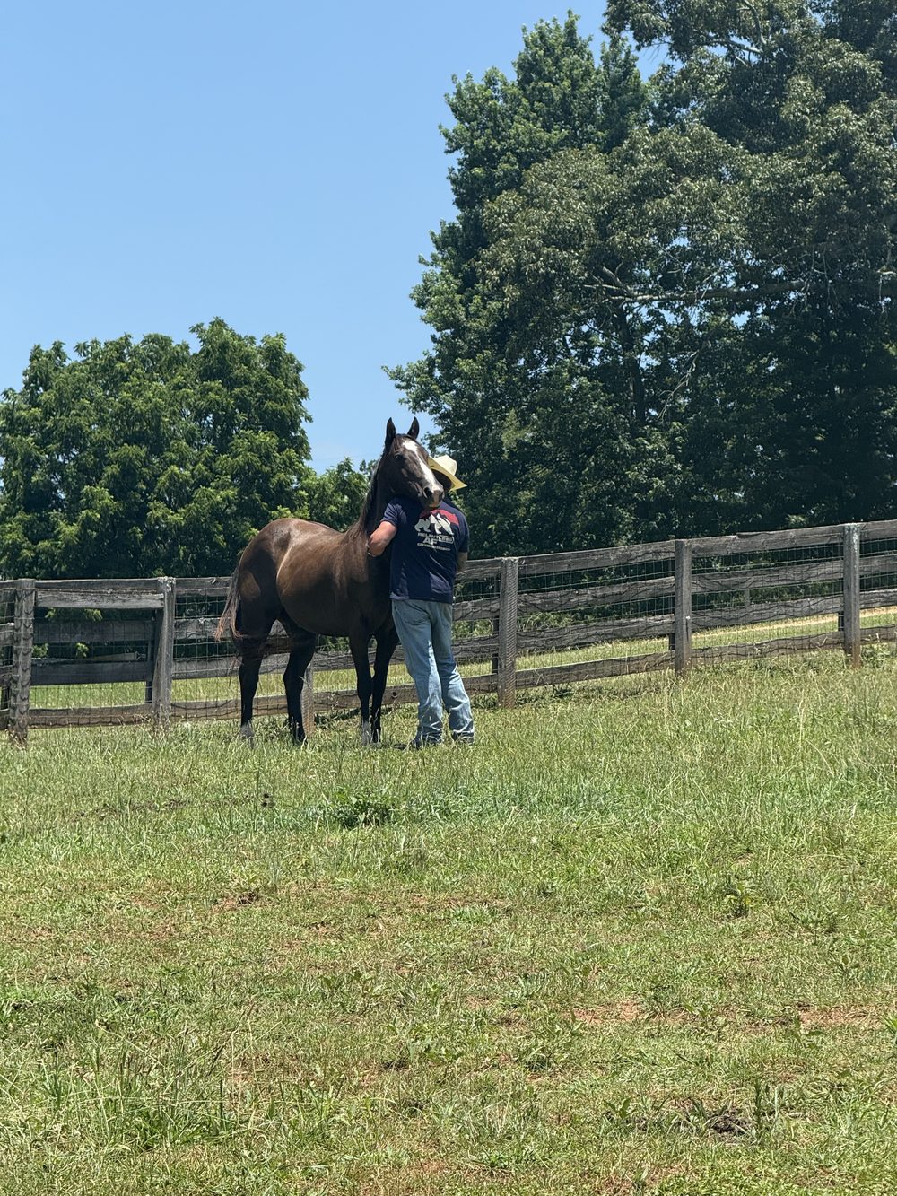 Brad Clark with a horse on family land in Hall County